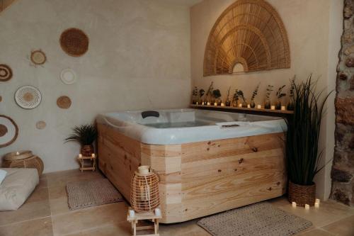 a bathroom with a wooden tub in a room at Le Château d'Argens in Les Arcs sur Argens