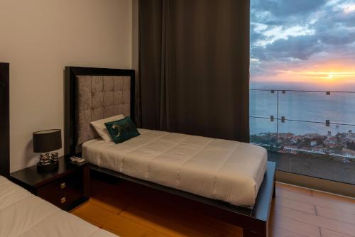 Postel nebo postele na pokoji v ubytování Funchal Harbour Home