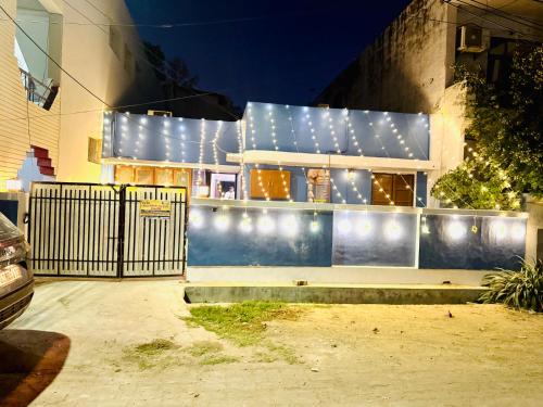 a building with lights on the side of it at The Family Courtyard, 5 Bed Room Boutique Villa and Guest Inn in Lucknow