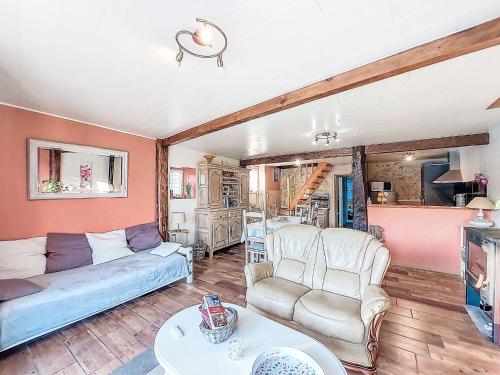 a living room with a couch and chairs and a table at Holiday Home Tuilières by Interhome in Cissac-Médoc