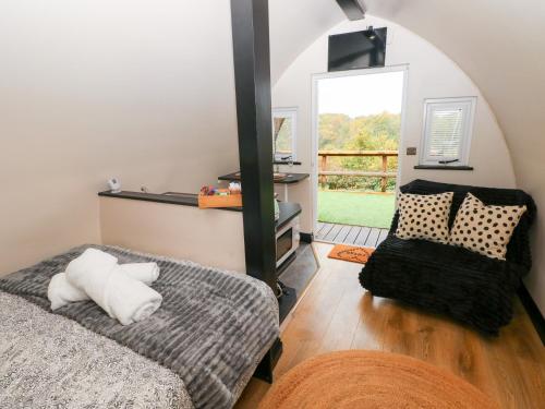 Ένα ή περισσότερα κρεβάτια σε δωμάτιο στο Cwtch Bach