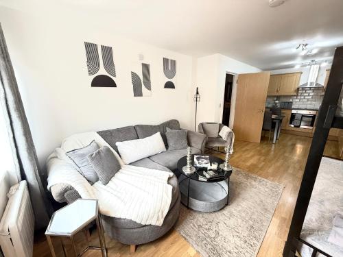a living room with a couch and a table at 15 min walk to Tower Bridge in London