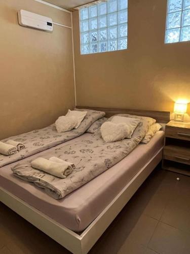 Katil atau katil-katil dalam bilik di Mecsek apartman