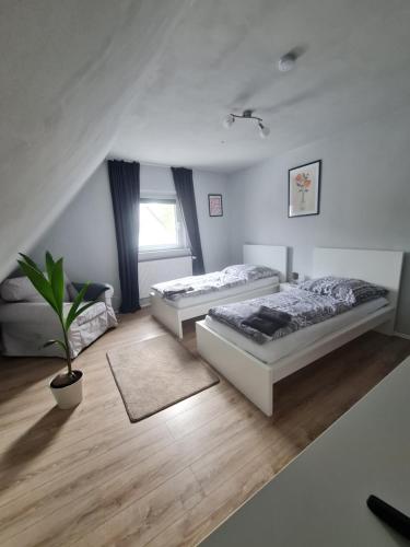 Postel nebo postele na pokoji v ubytování Ferienwohnung in der Ahornstrasse
