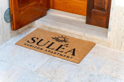 a welcome mat in front of a door at Suléa Horizon Apartment in Menfi