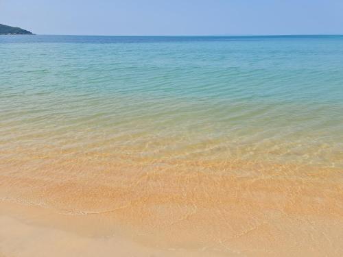 a view of the beach with sand and water at Lipa Bay Residence in Nathon Bay