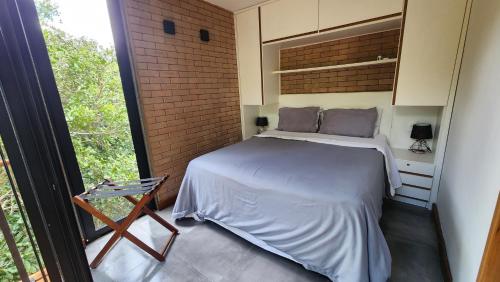 En eller flere senge i et værelse på Villa Oz021 Cottages