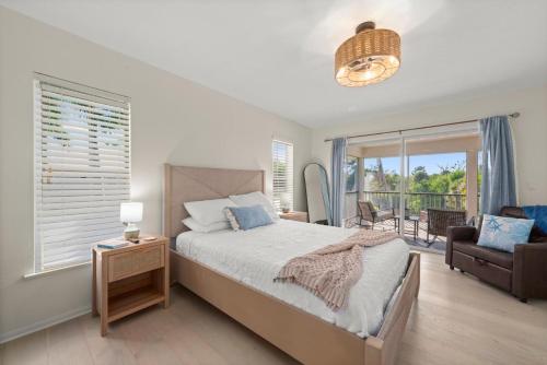 a bedroom with a bed and a balcony at Casa Al Mare in Sanibel Island