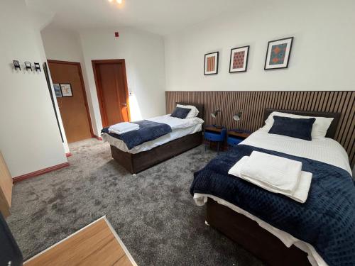 a hotel room with two beds in a room at Core Citi Lets, Guild Street Rooms in Aberdeen