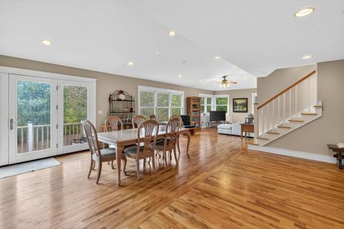 a dining room and living room with a table and chairs at Secluded Woodland Retreat Near Starved Rock Park home in Grand Ridge