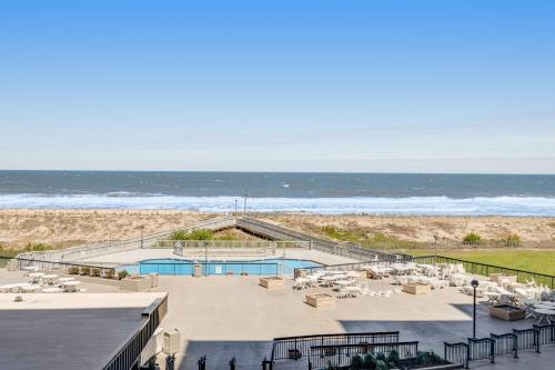 a view of the beach from the balcony of a resort at Sea Colony - 301S Edgewater House Rd in Bethany Beach