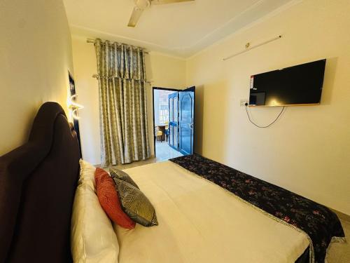 TV a/nebo společenská místnost v ubytování Avani