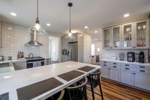 a kitchen with white cabinets and a white counter top at Eliza Gothic in Maquoketa