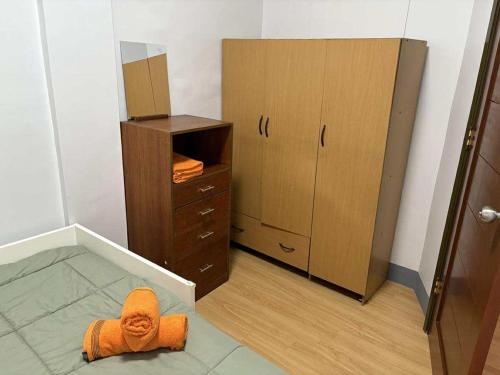 Ένα ή περισσότερα κρεβάτια σε δωμάτιο στο Molave Terraces