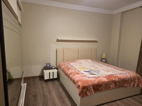 a bedroom with a bed in a white room at South B Paradise in Cairo