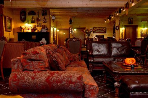 a living room with a couch and a table at Xilino Horio in Chrysomiléa