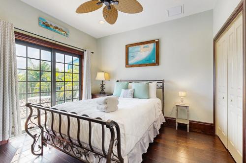 a bedroom with a bed and a large window at Key Quest in Marathon