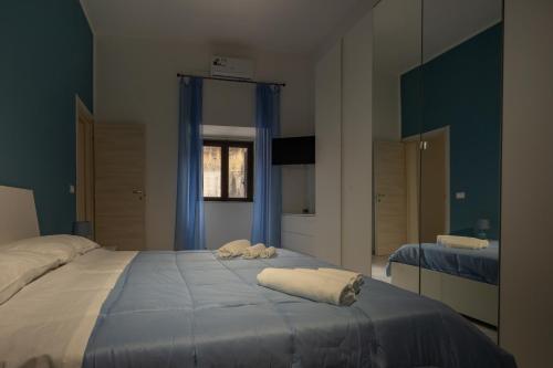 Ένα ή περισσότερα κρεβάτια σε δωμάτιο στο A casa di amici