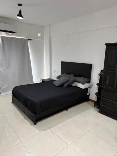 Postel nebo postele na pokoji v ubytování Loft Boutique Berazategui Centro