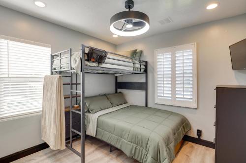 a bedroom with a bunk bed and a tv at Great Outdoor Space! Family Home in SLC Suburbs in Midvale