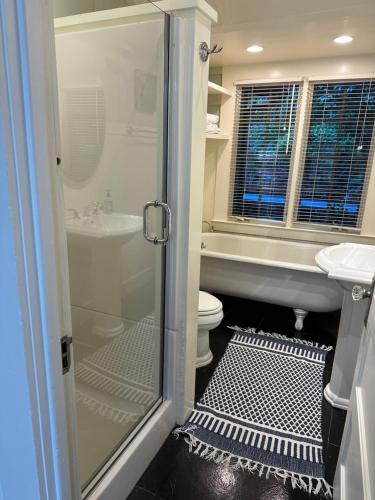 a bathroom with a shower and a toilet and a sink at Mill Valley Outpost in Mill Valley