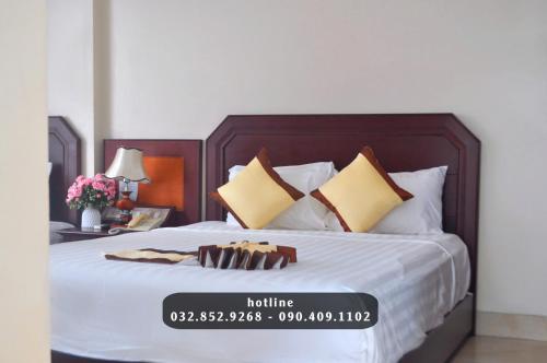 Ένα ή περισσότερα κρεβάτια σε δωμάτιο στο Hung Long Heritage Cat Ba Hotel