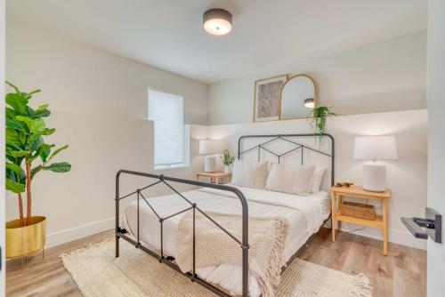 a bedroom with a bed with a metal frame at Stay Portland - The Madison Farmhouse - Vintage Shops & Espresso in Portland