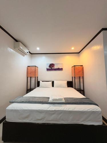 a bedroom with a large bed in a room at Clark stay in Fort Stotsenburg