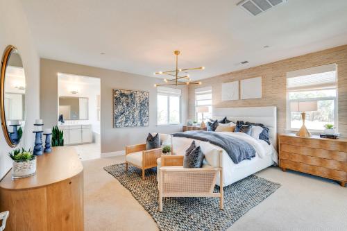a bedroom with a bed and a living room at Elegant and Spacious Retreat with Yard in Woodland! in Woodland