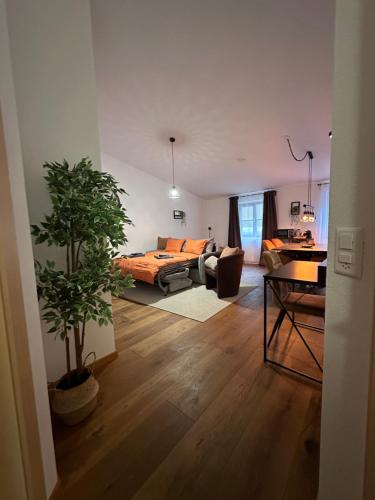 a living room with a bed and a couch at Work and Chill Apartment near Zermatt and Lonza in Stalden