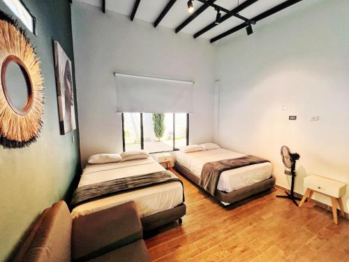 Ένα ή περισσότερα κρεβάτια σε δωμάτιο στο Finca hotel villa del lago