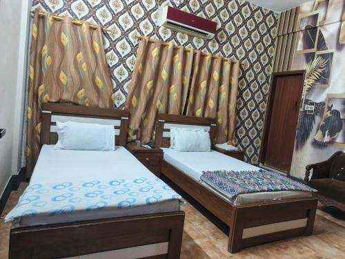 Ένα ή περισσότερα κρεβάτια σε δωμάτιο στο Safari Guest House