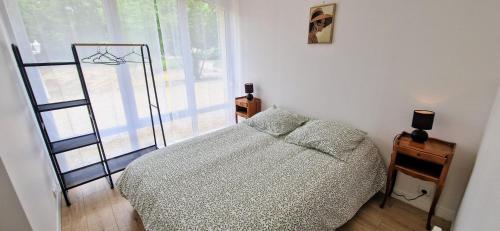 Postel nebo postele na pokoji v ubytování Le Clos Beau Jardin