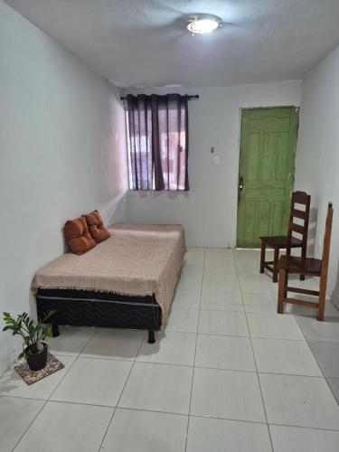 En eller flere senge i et værelse på Casa bem localizada na Cidade Nova