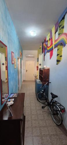 a hallway with a bike parked in a room at Vista mozzafiato e terrazza panoramica -Il Sogno- in Cuglieri