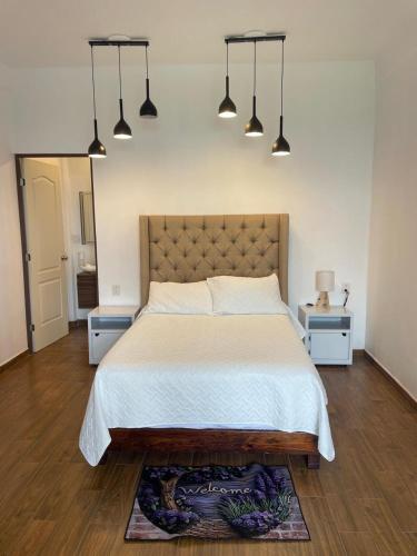 Postel nebo postele na pokoji v ubytování Granja & Vivero Lavanda