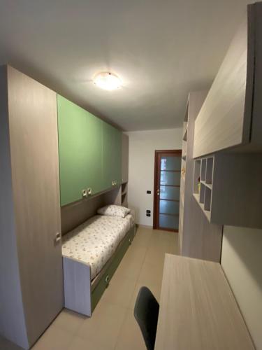a small bedroom with a bed in a room at The Prince's Nest in Potenza