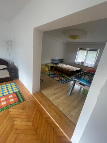 a living room with a bed and a table at Bosa House in Belgrade