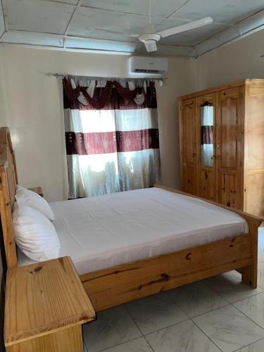 Giường trong phòng chung tại Jammaisar Residence