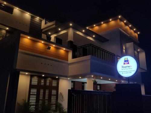 a building with a sign in front of it at night at Roameo, Varkala - A Cowork by The Hostel Stories in Varkala
