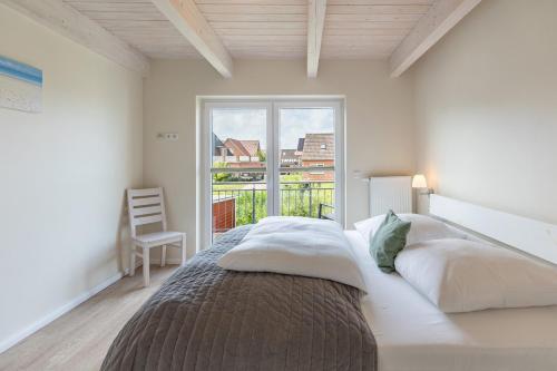 Ένα ή περισσότερα κρεβάτια σε δωμάτιο στο Fischerhuus