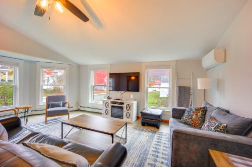 a living room with a couch and a table at Comfortable Lincoln Home Walk to Main Street! in Lincoln