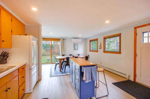a kitchen with a counter and a table and chairs at Comfortable Lincoln Home Walk to Main Street! in Lincoln