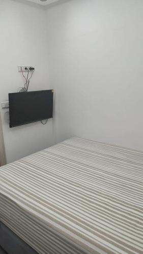 Ένα ή περισσότερα κρεβάτια σε δωμάτιο στο Studio LILA