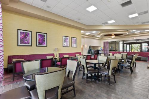 a dining room with tables and chairs at Orlando Palms in Orlando