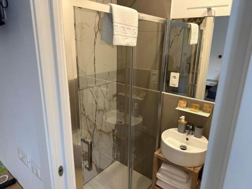 a bathroom with a shower and a sink at Le camere al San Martino in La Spezia
