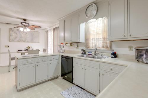 a kitchen with white cabinets and a sink at Playground and Grill Pet-Friendly Griffin Getaway! in Griffin