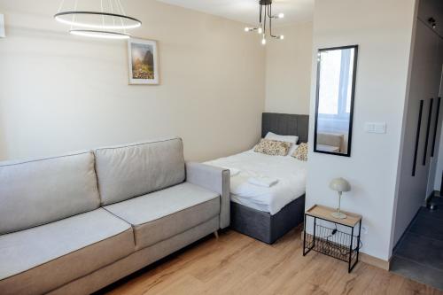 Ένα ή περισσότερα κρεβάτια σε δωμάτιο στο Lubelski Kadr