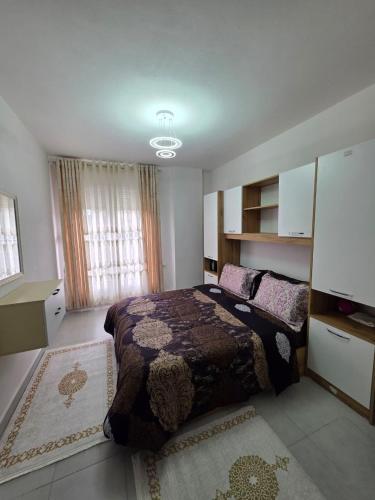 a bedroom with a large bed in a room at Diana Home34 in Tirana