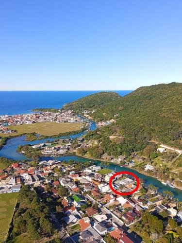 a town with a red circle in the middle of a river at Floripa Glamping in Florianópolis